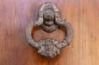 Albaicin, Province of Granada, Andalusia, Spain. An old metal knocker decorated with a human head. Art Print